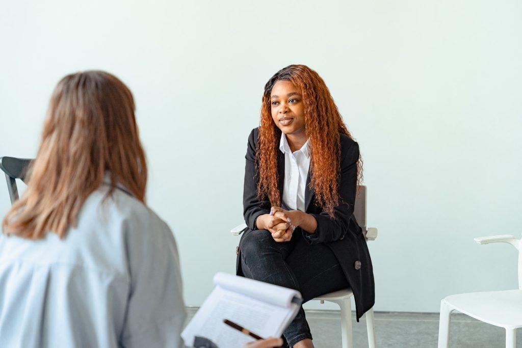 young POC meeting with therapist 